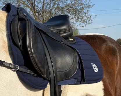 Serra saddle pad in Midnight fitted under English saddle
