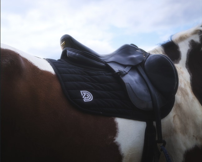 Serra saddle pad in Obsidian fitted under English saddle