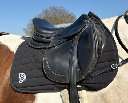Serra saddle pad in Obsidian fitted under English saddle